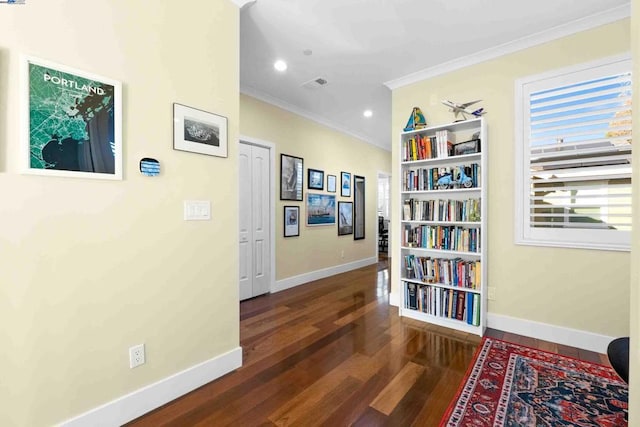 hall with crown molding and dark hardwood / wood-style floors