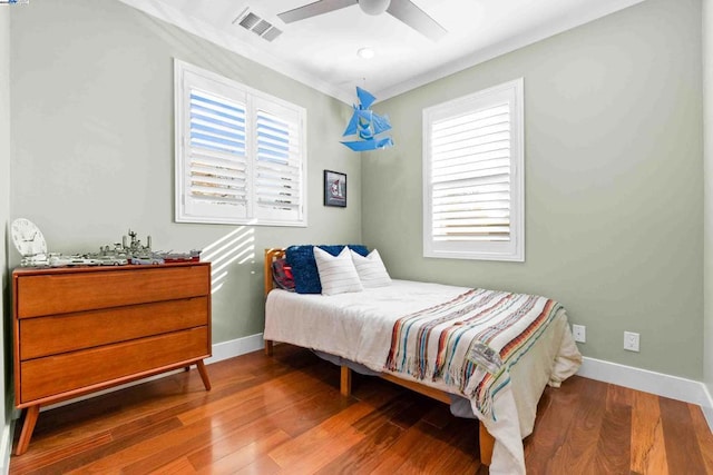 bedroom with hardwood / wood-style flooring and ceiling fan