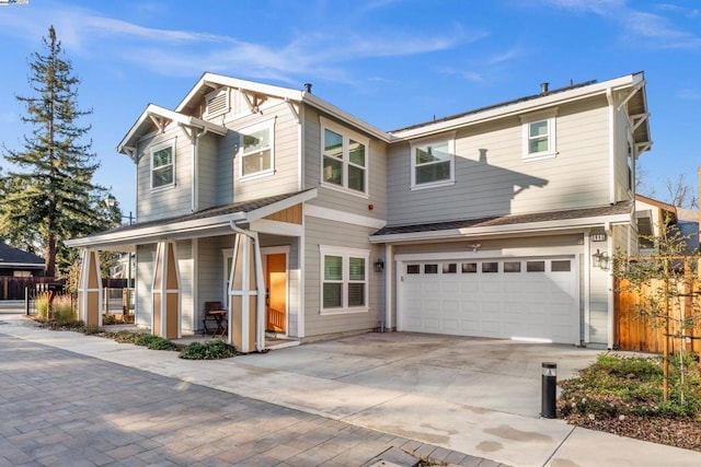 view of front of property featuring a garage and covered porch