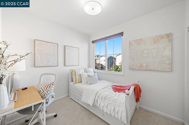 bedroom featuring light colored carpet