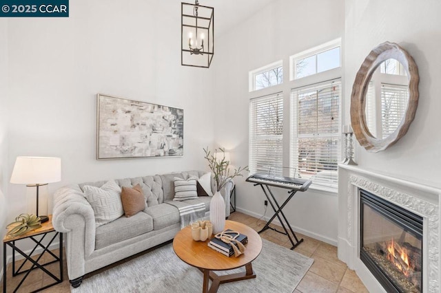 tiled living room with a chandelier