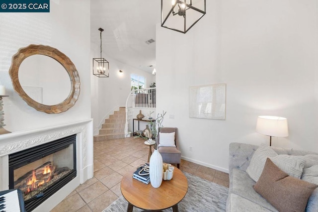 living room featuring light tile patterned floors and a chandelier