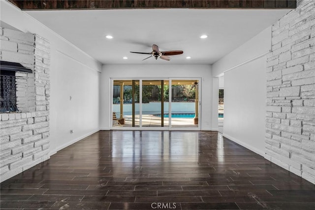 unfurnished living room featuring ceiling fan