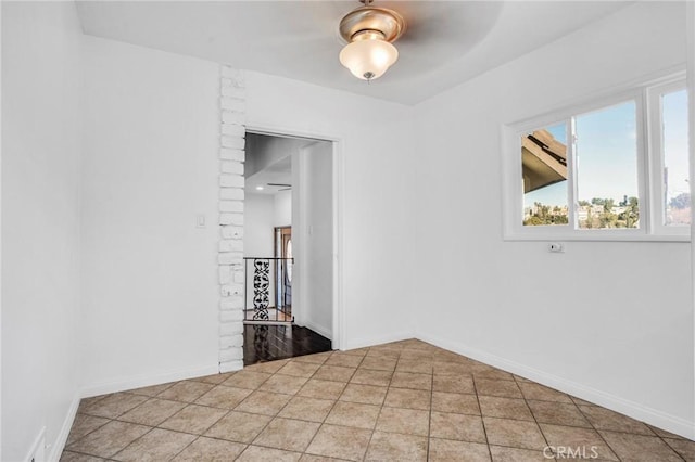 spare room with tile patterned floors