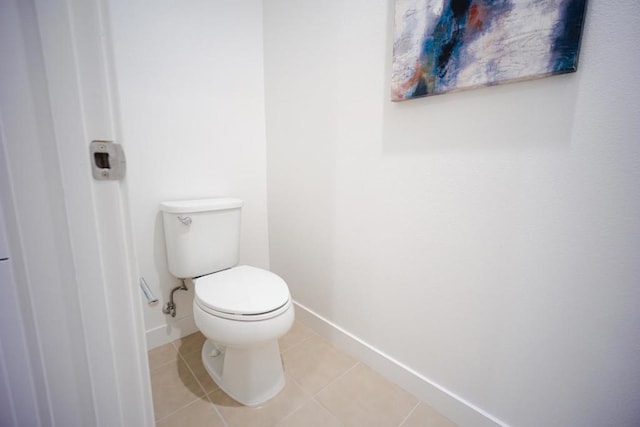 bathroom with tile patterned floors and toilet