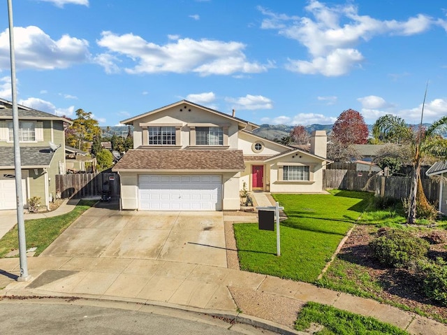 view of front of house with a garage and a front yard