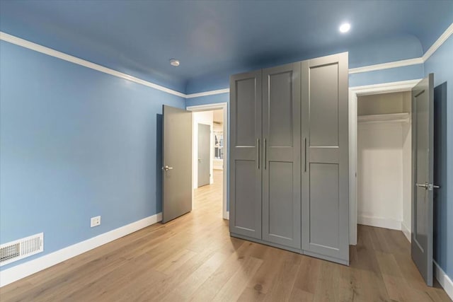 unfurnished bedroom featuring light hardwood / wood-style floors