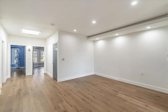 spare room featuring light hardwood / wood-style floors