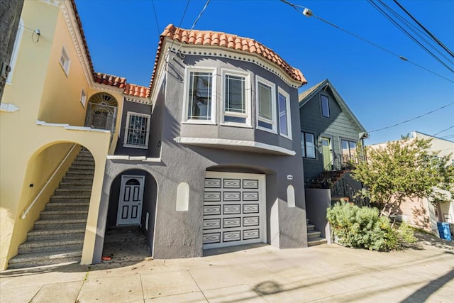 mediterranean / spanish-style house featuring a garage