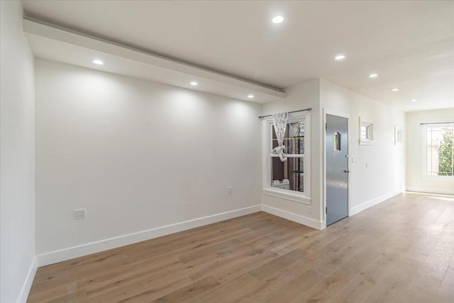 unfurnished room featuring light wood-type flooring