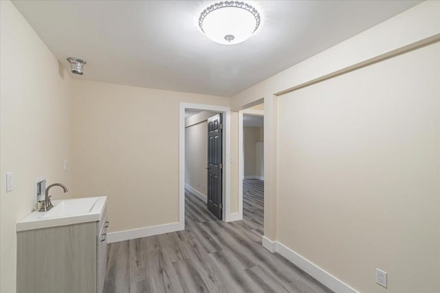 interior space featuring sink and hardwood / wood-style floors