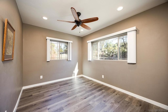 unfurnished room with hardwood / wood-style floors and ceiling fan