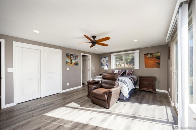 bedroom featuring ceiling fan and dark hardwood / wood-style flooring