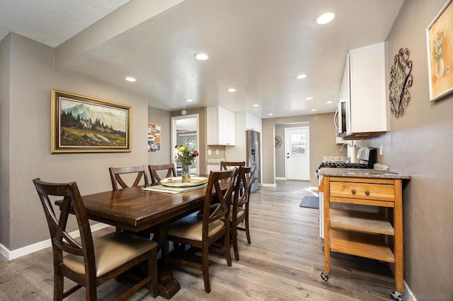 dining space featuring light hardwood / wood-style flooring