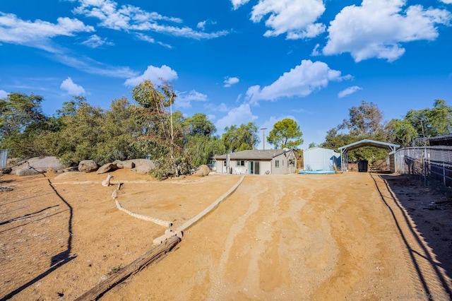 view of yard with a carport