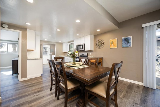 dining room with dark wood-type flooring