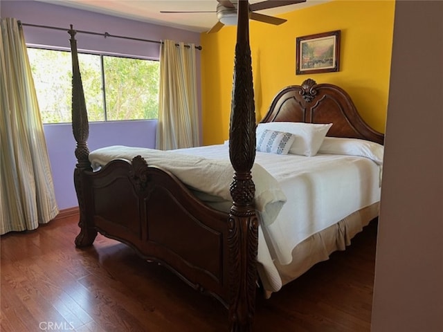 bedroom with hardwood / wood-style floors and ceiling fan