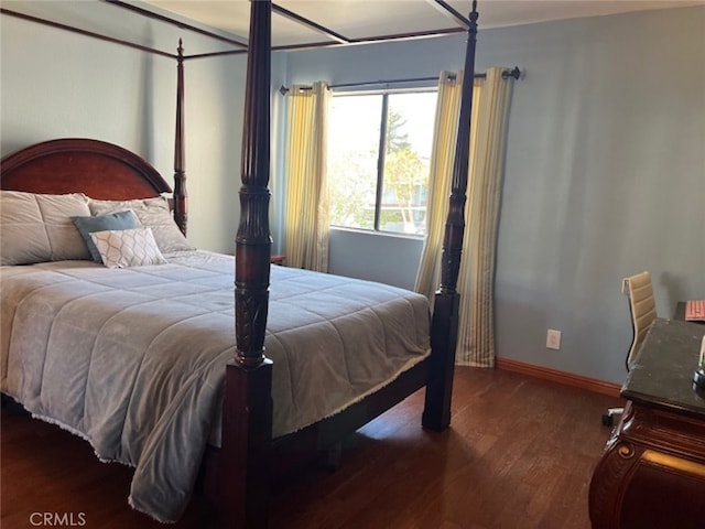 bedroom featuring dark wood-type flooring