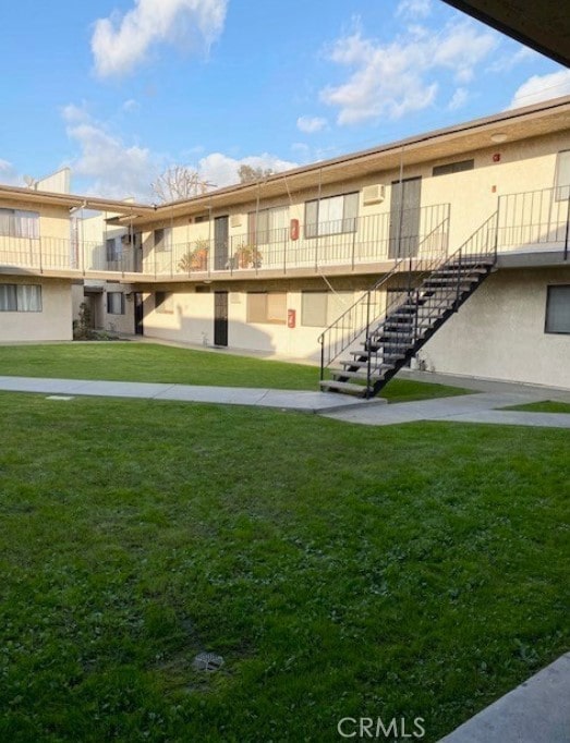 view of home's community with a lawn