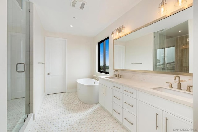 bathroom with separate shower and tub and vanity