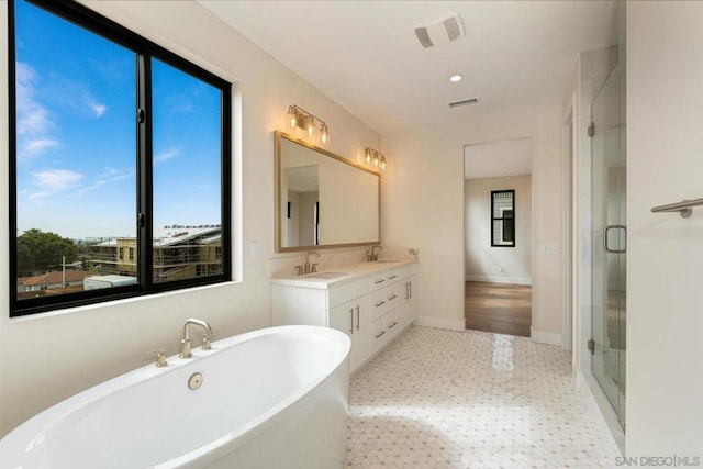 bathroom with vanity and plus walk in shower