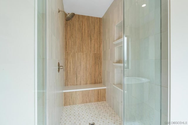 bathroom with tiled shower