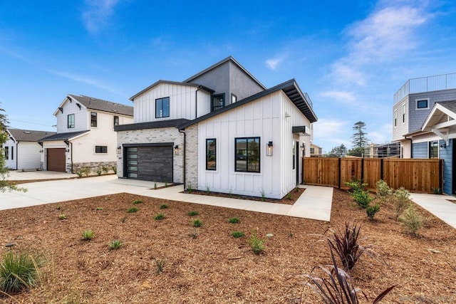 modern farmhouse style home featuring a garage