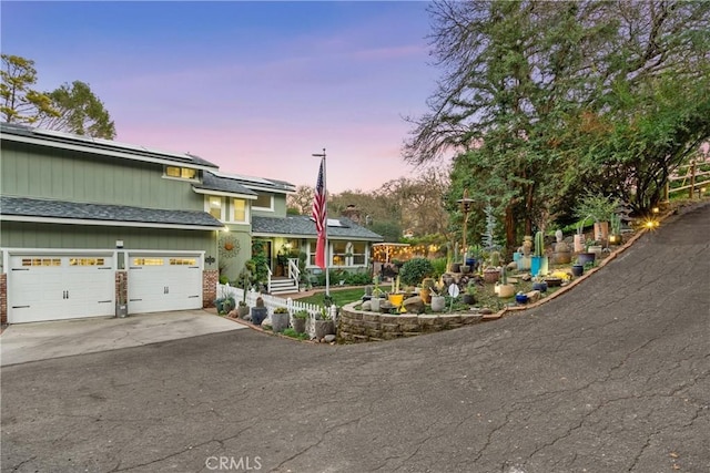 view of front of property with a garage