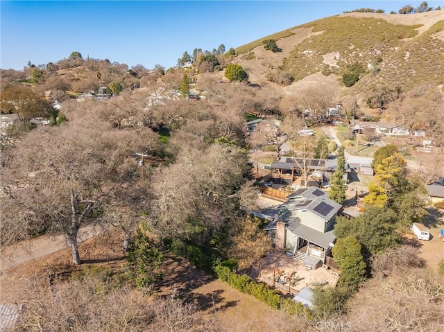 birds eye view of property with a mountain view