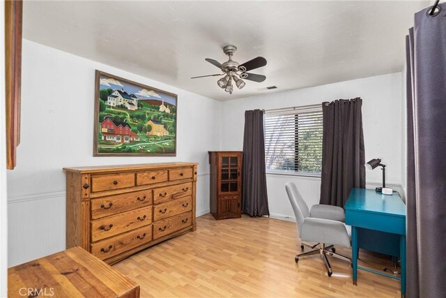 office space with ceiling fan and light hardwood / wood-style flooring