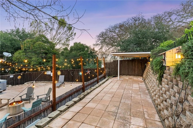 view of patio terrace at dusk