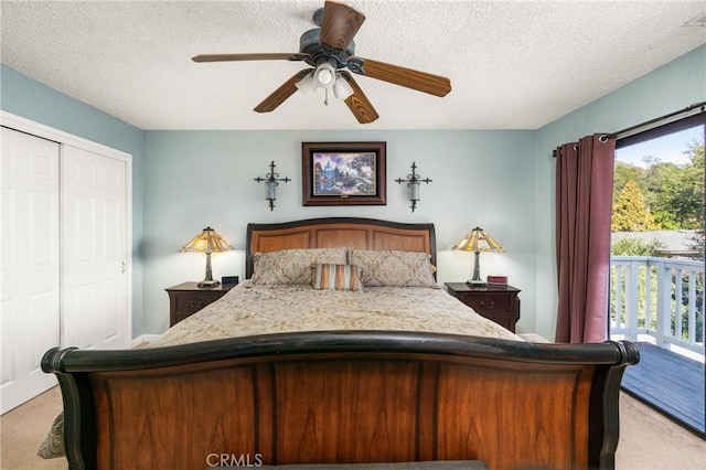 bedroom with a closet, access to exterior, ceiling fan, and light carpet