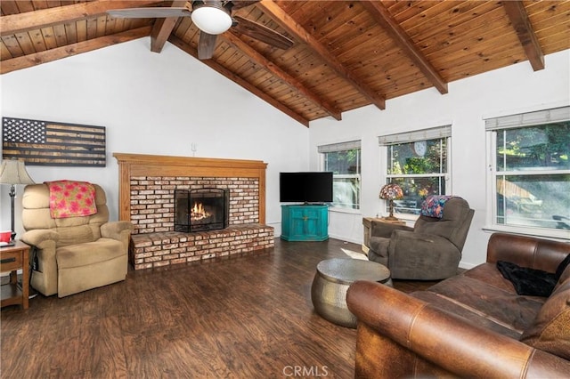 living room with beamed ceiling, ceiling fan, dark hardwood / wood-style floors, a brick fireplace, and wooden ceiling