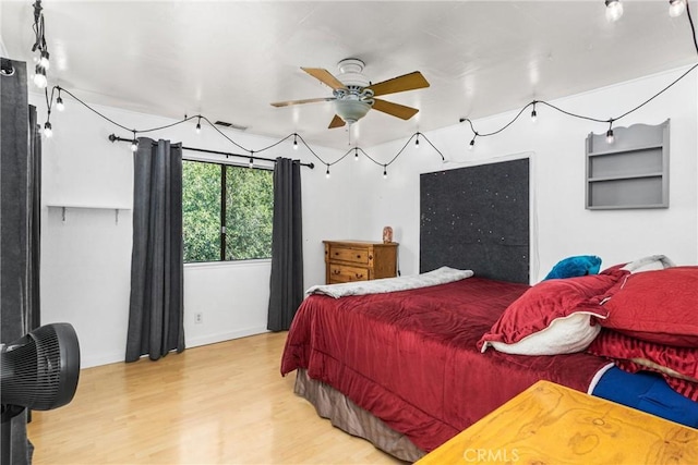 bedroom featuring ceiling fan and wood-type flooring