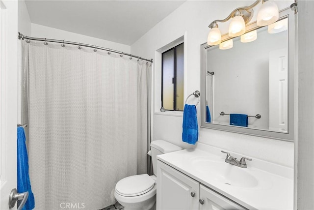 bathroom featuring toilet and vanity