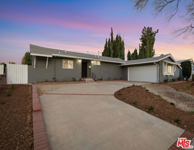 single story home featuring a garage