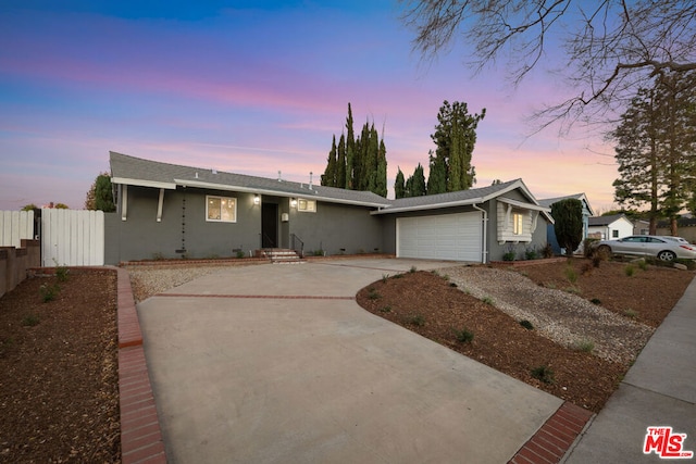 ranch-style house featuring a garage