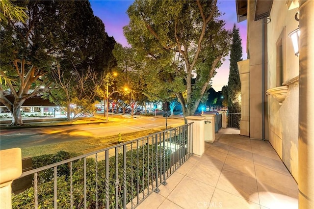 view of balcony at dusk