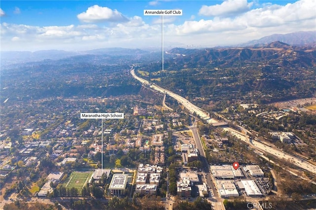 birds eye view of property with a mountain view