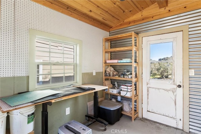 office with lofted ceiling, wooden ceiling, and concrete floors