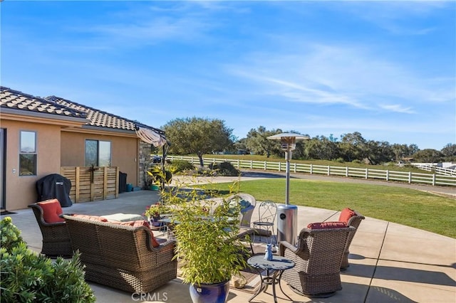 view of patio / terrace with a rural view