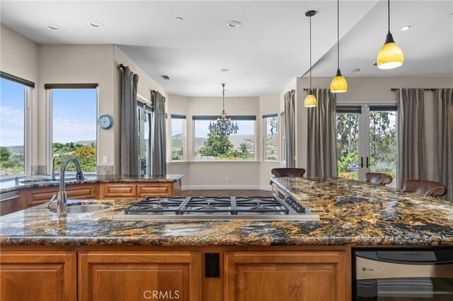 325 Red Oak Way, Arroyo Grande, CA 93420 - kitchen featuring brown cabinets, wine cooler, a kitchen island with sink, dark stone countertops, and stainless steel gas cooktop