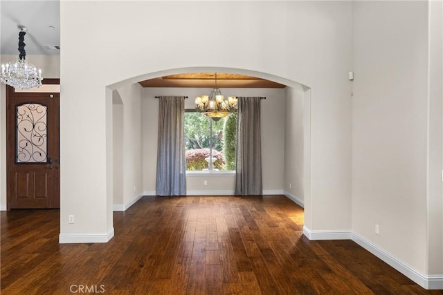 325 Red Oak Way, Arroyo Grande, CA 93420 - foyer entrance with a chandelier, arched walkways, and dark wood-style flooring