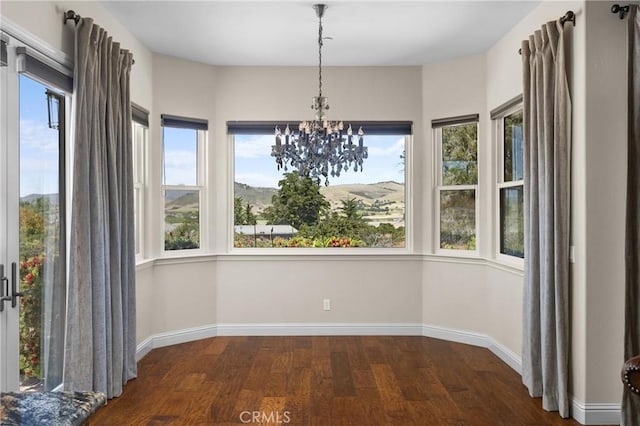 325 Red Oak Way, Arroyo Grande, CA 93420 - unfurnished dining area with wood finished floors, a chandelier, and baseboards