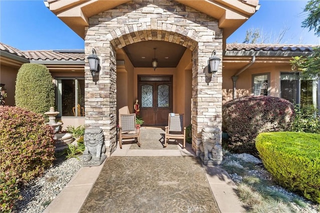 325 Red Oak Way, Arroyo Grande, CA 93420 - property entrance with stone siding, a tiled roof, and stucco siding