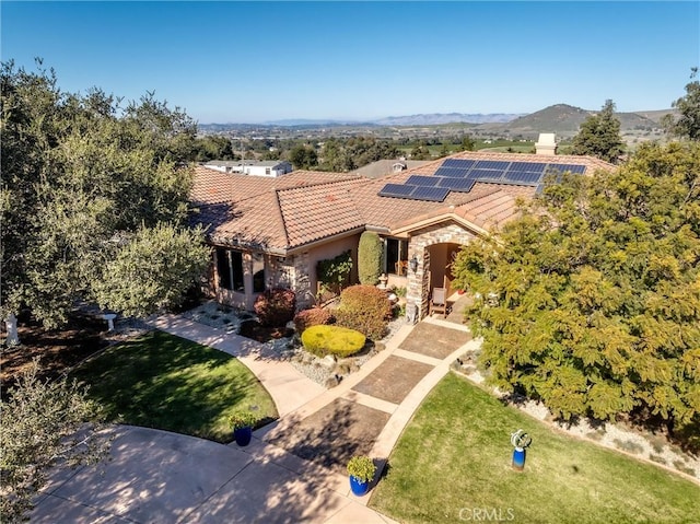 325 Red Oak Way, Arroyo Grande, CA 93420 - mediterranean / spanish-style home featuring solar panels, stone siding, a front lawn, and a tiled roof