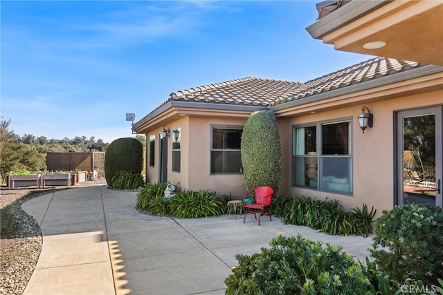 325 Red Oak Way, Arroyo Grande, CA 93420 - view of home's exterior featuring stucco siding, a patio area, and a tile roof
