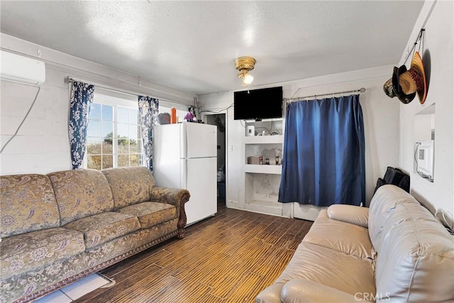 living room featuring wood-type flooring and a wall unit AC