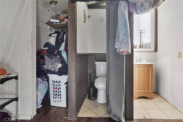 bathroom with vanity, toilet, and tile patterned flooring