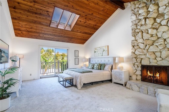 bedroom with carpet flooring, access to exterior, a skylight, and high vaulted ceiling